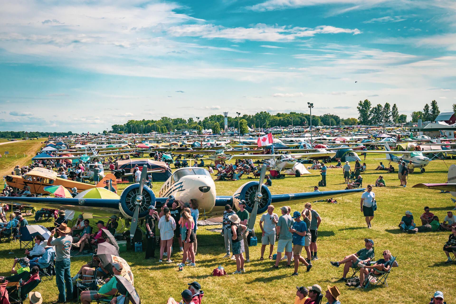 A field of planes and people at Oshkosh Airventure