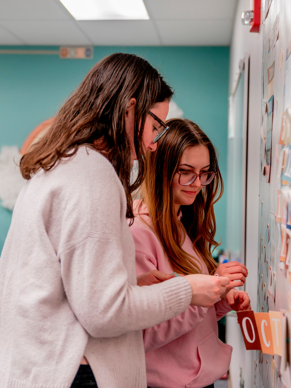 Students working on a bulletin board