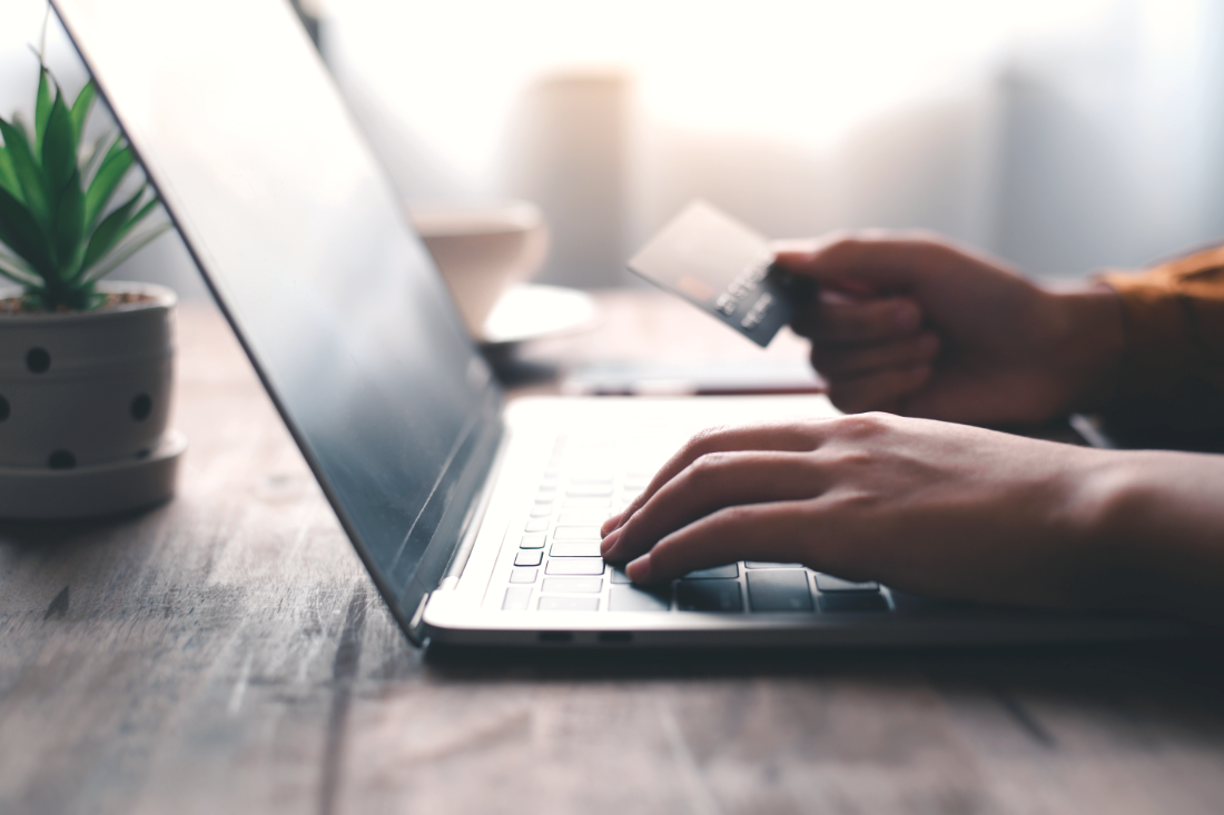 Making an online gift using a credit card and laptop